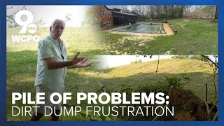 Dirt pile towering over Colerain homes draws complaints, calls for solutions