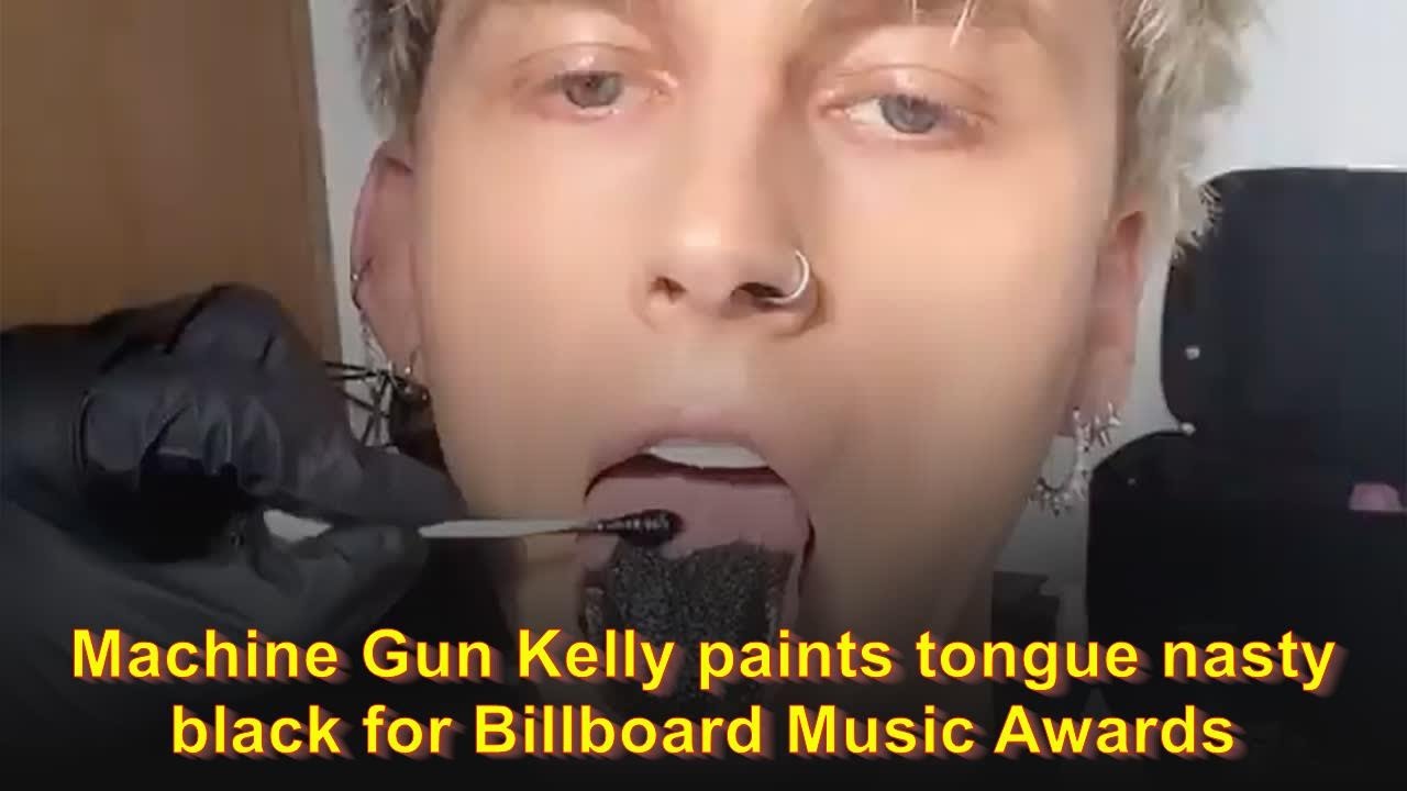 Machine Gun Kelly paints tongue black for Billboard Music Awards ...