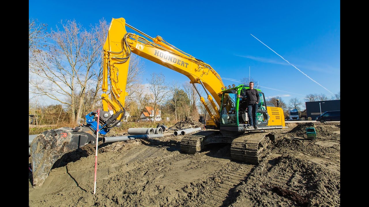 Hybride Kobelco SK210HLC-10 voor Hoondert
