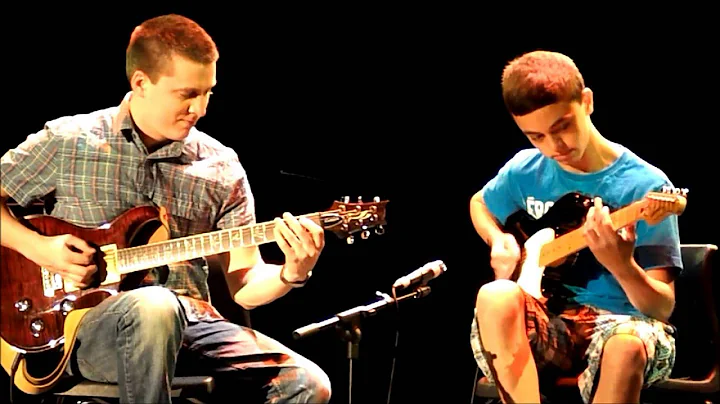 Spencer Lockhart and his guitar teacher Adrien