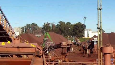 Loading iron ore at San Nicolas port / New Port berth south section.-
