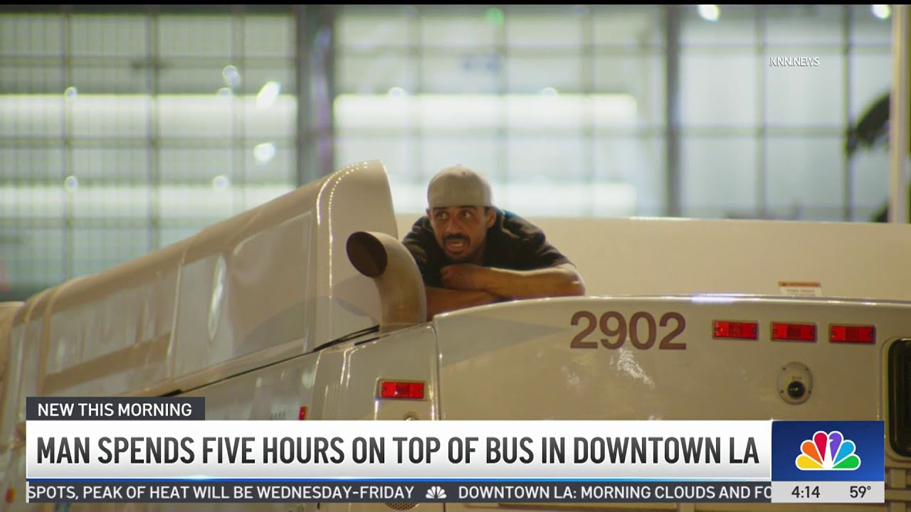 Man climbs on top of bus and stays there for 5 hours in downtown LA ...