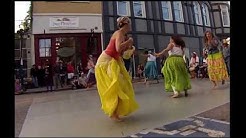 Dancers dancing to Haitian singing and drumming.