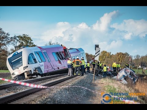 Train crashes into milktruck in Winsum the Netherlands, multiple people injured.