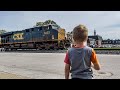 Train tracking 10  levi watches very long csx freight train fly through town