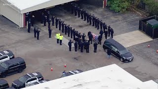 Body of HPD Officer Ernest Leal, Jr., arrives at funeral home