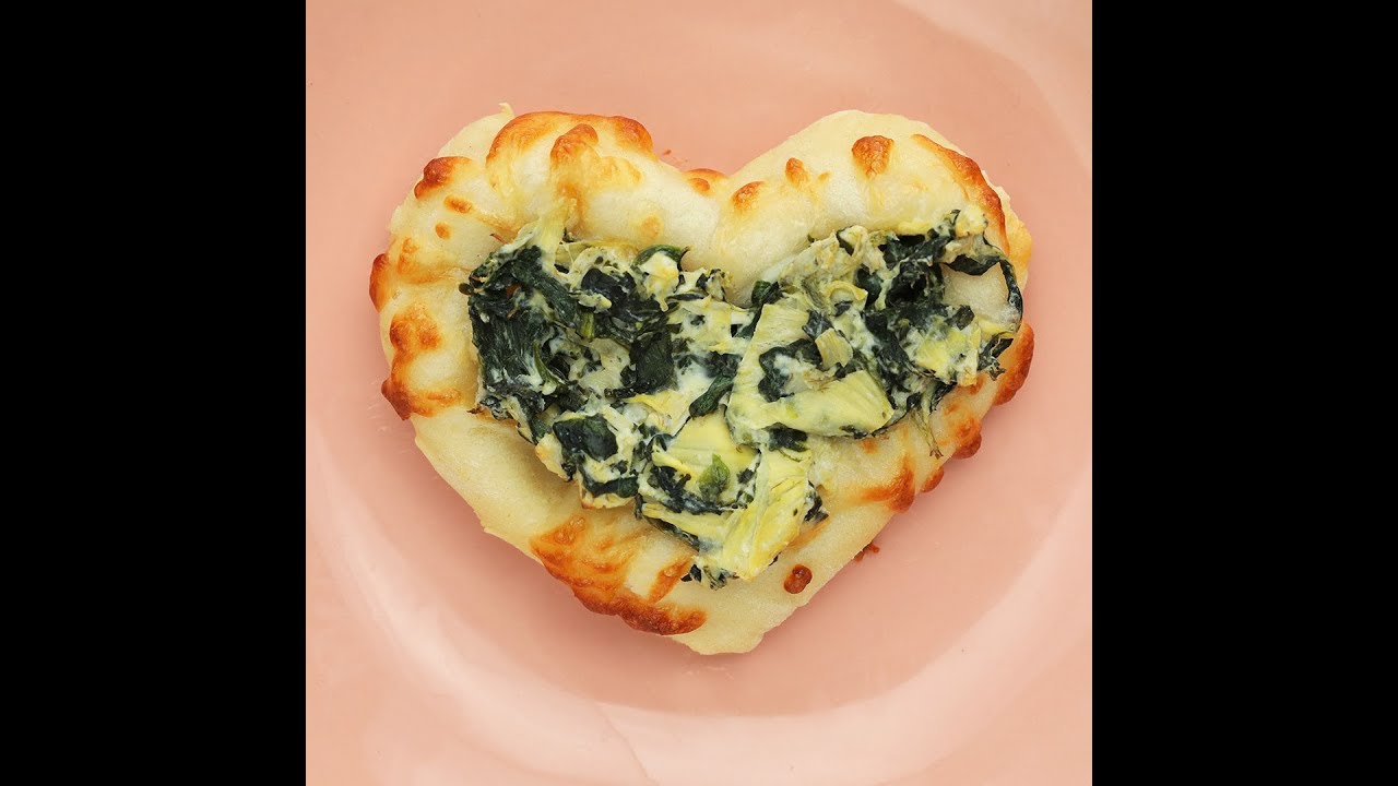 Heart-Shaped Mini Pizzas in 15 Minutes or Less // Presented by BuzzFeed & GEICO - Celebrate Valentine's Day with your family by making these delicious pizzas. They're as easy as signing up for GEICO, where you could save 15% or more on car in