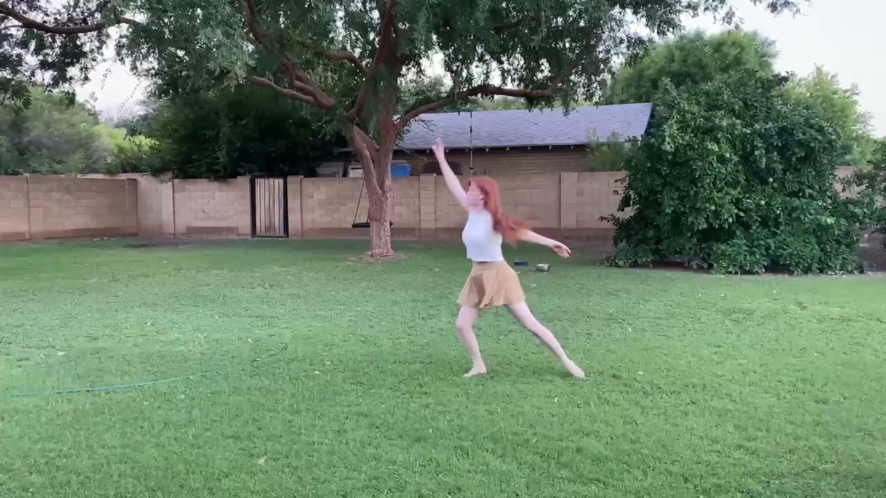 Sarah dancing with backyard chickens 