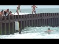 Some guy learning to surf on the wrong day