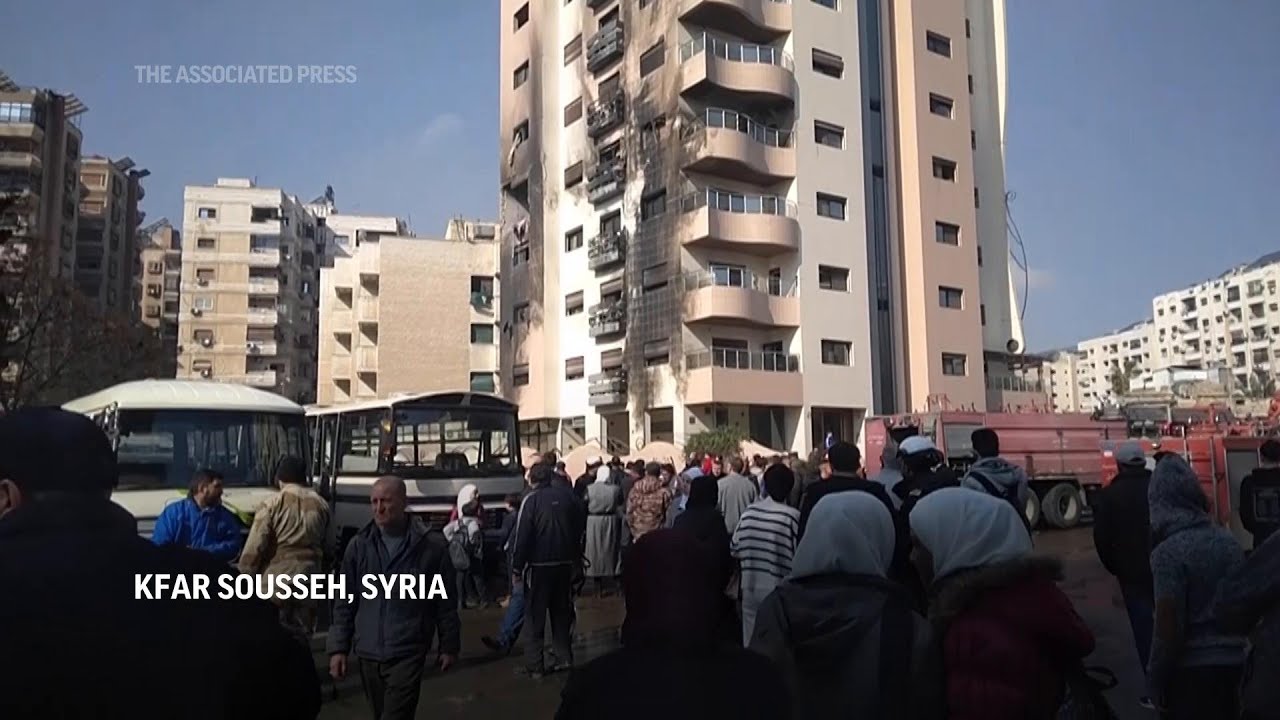 Aftermath in Damascus neighborhood, after Syrian state TV reported Israeli strikes hit the area