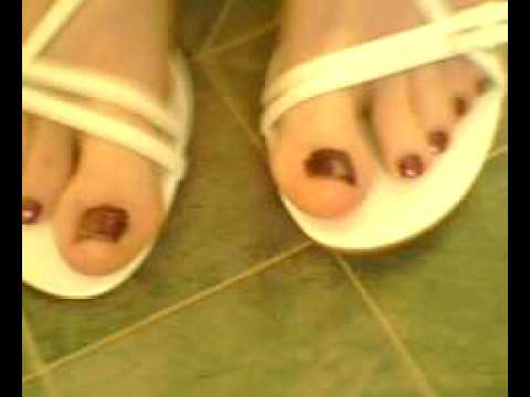 Olivia's painted toes and white heels