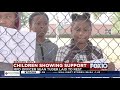 Fonde Students Watch And Wave With Encouraging Signs Fonde Students Watch And Wave With Encouraging Signs