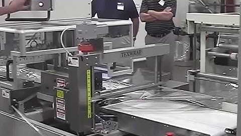 Continuous Motion Side Seal Wrapping Stacks of Vinyl Trim Boards - STB-1809SS