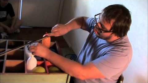 Travis Johnson at Apartment Music 8 improvisation balloons membranophone