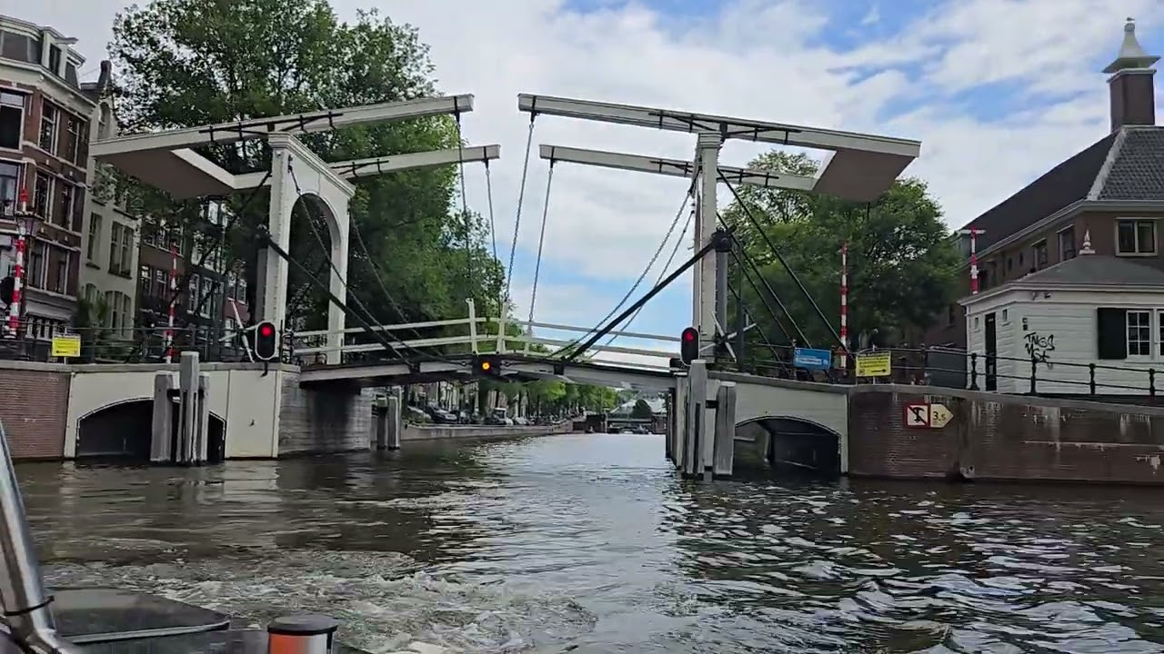 Pure boats, Amsterdam,The skinny bridge,James Bond scene "Diamond are forever" over the river Amstel