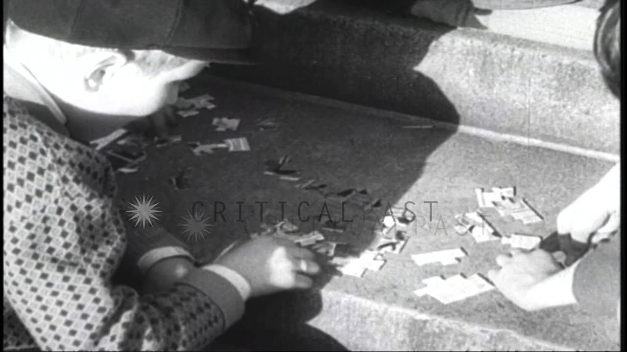 Women smoke pipes and people fit jigsaw puzzles in the United States. HD Stock Footage