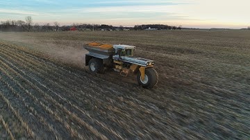 Spreading Fertilizer at the River Farm