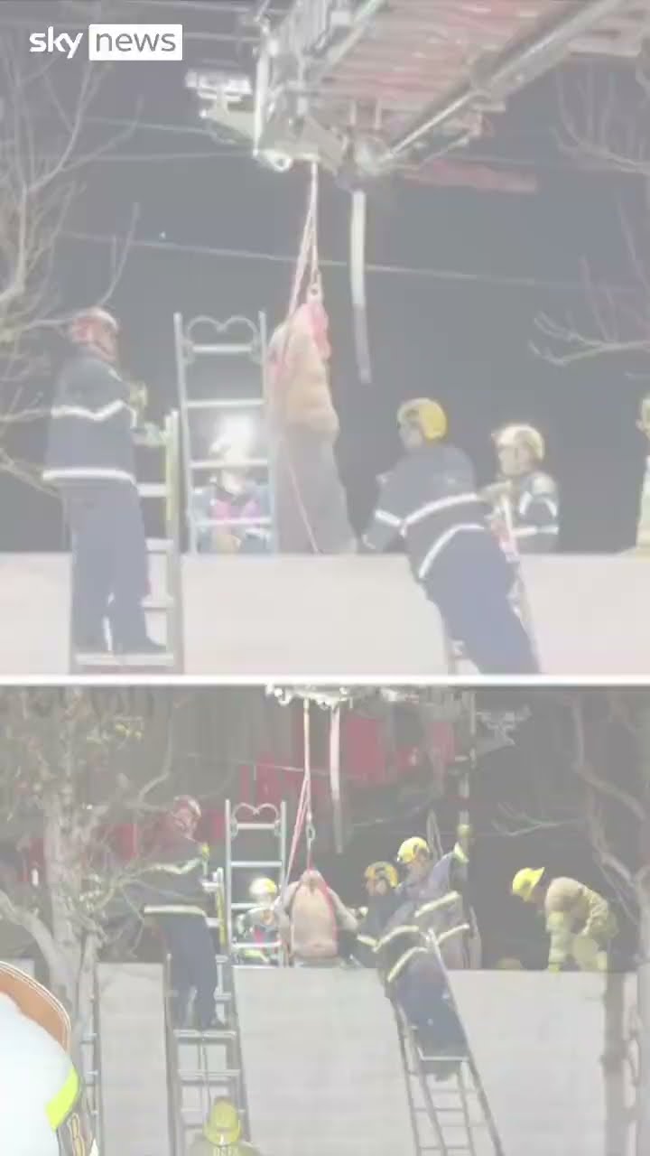 Moment man stuck between two walls is rescued