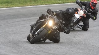 BMW S 1000 R, KTM 690 SMC R, Honda CBR 1000 RR Repsol on a race track