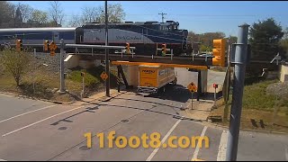 Rental boxtruck gets stuck as train crosses the 11foot8+8 bridge