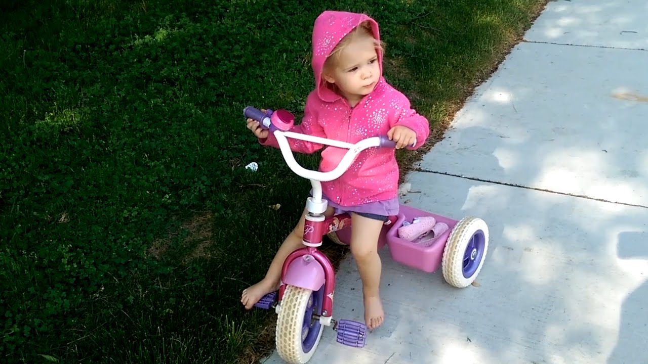 child riding tricycle