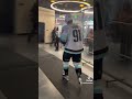 Daniel sprong waking into a mullet arena locker room shorts