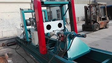 Log turning lathe for log cabins and wood construction