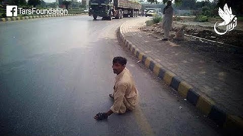 TARS Foundation | Helping a Disabled Man in Crossing a Busy Road in Peshawar