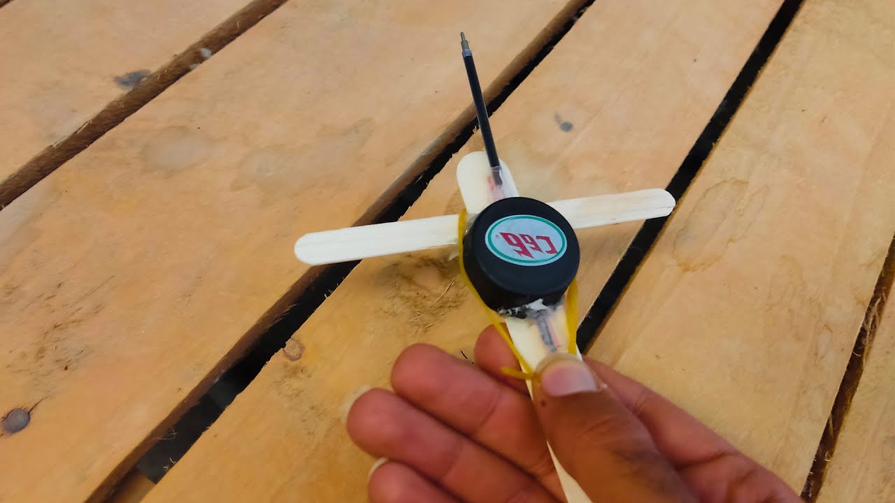 How to make Rubber band gun using plastic bottle cap and Icecream stick at home YouTube