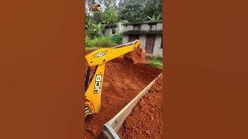 Loading soil into a truck. using a JCB. Jcb 3dx loading soil into a tata truck.