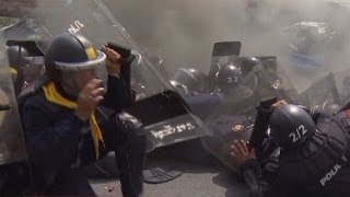 Thai police and protesters exchange gunfire