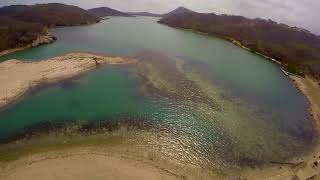 Using a drone (UAV) to survey a bay in Curacao for marine research collections.