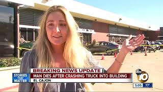 Man dies after crashing truck into building