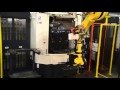 Automated manufacturing system with robotic deburring and vision system