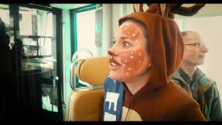 A rabbit and a reindeer wondering about DA-Group technology on a tram. Safe and fun to travel!