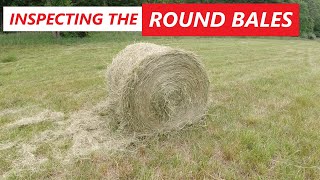 Inspecting The Round Bales