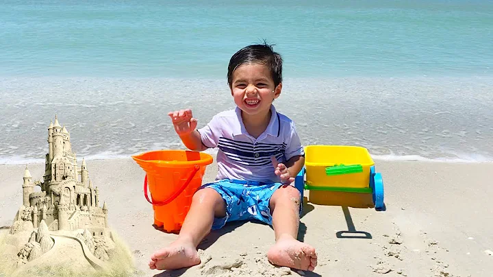 Jared at the beach and playing in the sand