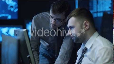 Two IT Programmers are Working on Computer in Dark Office Room Filled with | VideoHive 14699932