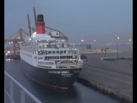 QE2 sounds her whistle to Queen Mary 2 in Dubai.