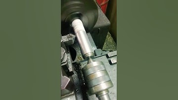 USING A KNIFE TOOL GET STEEL BAR TO SIZE ON THE UNIVERSAL LATH IN THE MECHANICAL WORKSHOP