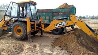 Jcb & truck doing work together