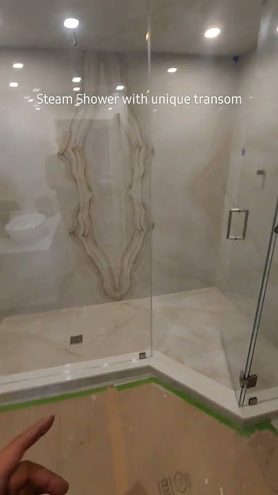 full height steam shower enclosure with a uniquely designed transom #steam #frameless #showervent