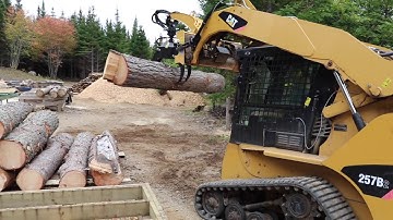 Unloading logs with skid steer grapple