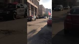 Procession carrying fallen Officer Michael Michalski passes through downtown
