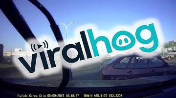 Collision Sends Car Flying into Oncoming Lane || ViralHog