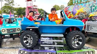 Fun Kids Rides at the Fair Outdoor Amusement Park with Troy and Izaak