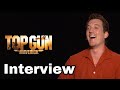 Miles Teller HUNG UP on Tom Cruise! Actor talks playing 'Rooster' in Top Gun: Maverick / INTERVIEW