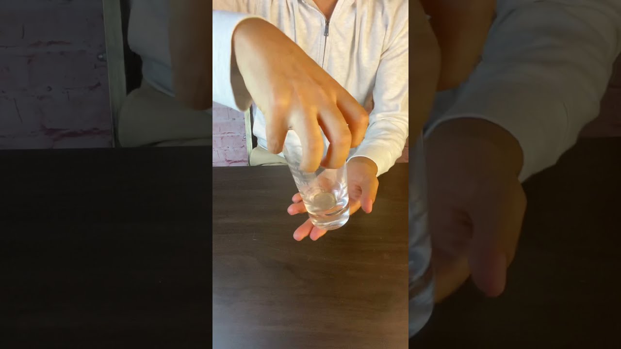 1-minute reveal] Coin piercing glass trick - YouTube