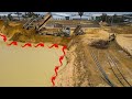 Incredible big bulldozer komatsu d58p pushing dirt drop in deep water with dumper truck unloading