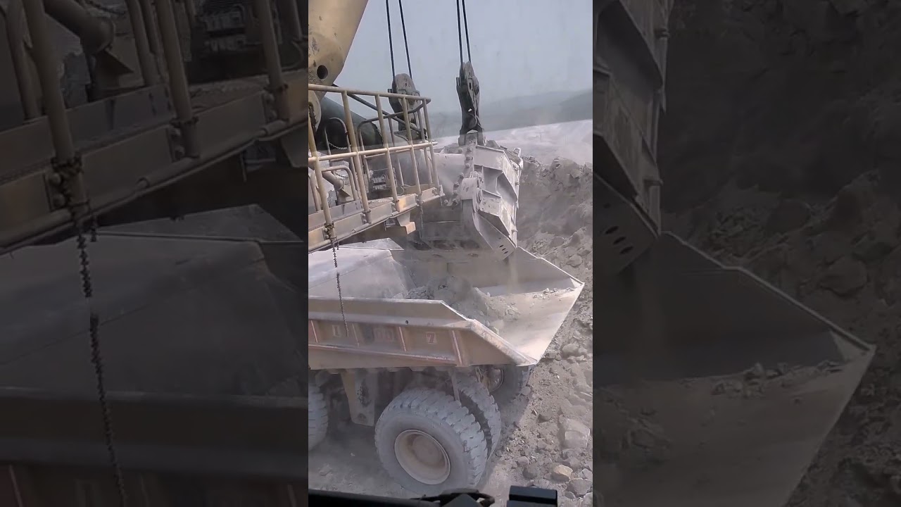 Loading of over burden (OB) in  dumpers by Shovel 